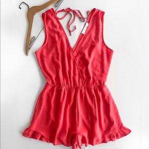 ASTR • Coral Surplice Ruffle Hem Tie-Back Romper